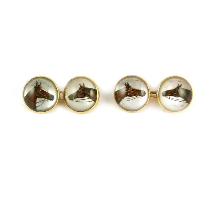 Pair of 19th century reverse painted rock crystal cufflinks with horse's head motifs